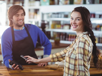 Person paying with smartphone using digital wallet